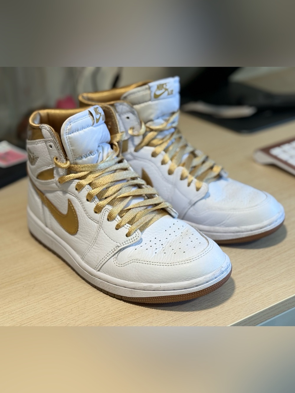 Nike Women’s White and Gold High-Top Sneakers with Metallic Swoosh